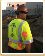 This guy is really into it- he is wearing a Hawaiian Safety Shirt over a Hawaiian shirt! Hawaiian Safety Vest