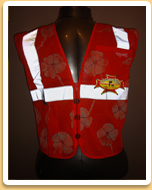 Orange You Safe Hawaiian Safety Vest front view at night Mello Yello Hawaiian Safety Vest back view at night
